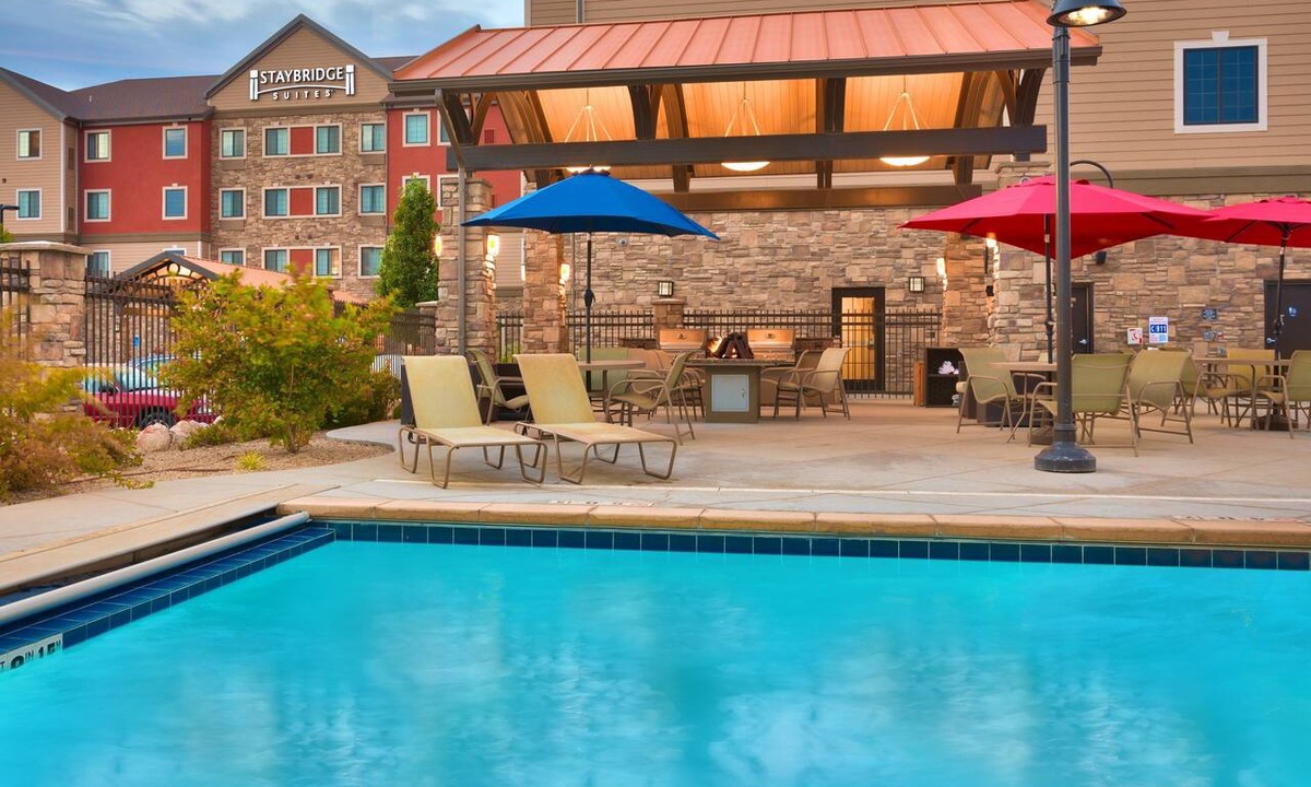 Midvale Apartment | King Suite | Heated Pool & Hot Tub. Free Breakfast Buffet. Near Jordan Landing!
