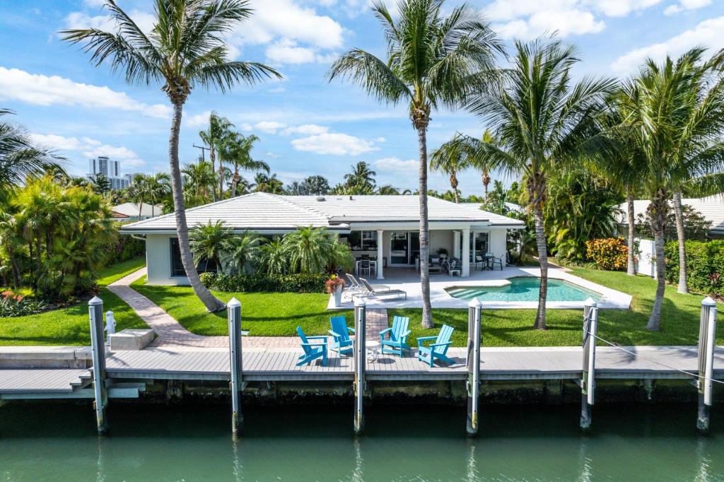 Singer Island Villa | Seven Palms Waterfront- Private Dock, Heated Pool & Lanai -Walk to beach! by Maven Vacation Rentals