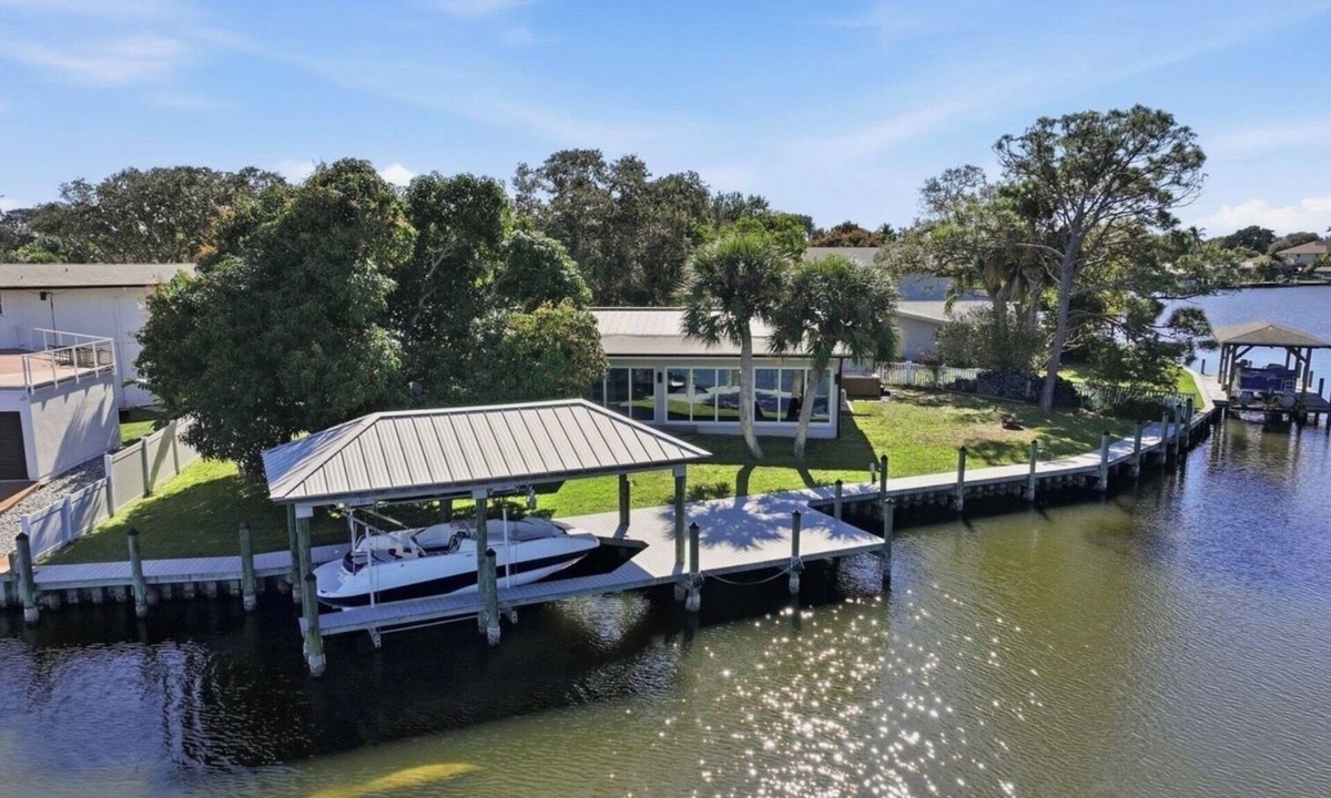 Cocoa Isles House | Waterfront with New POOL, Bikes, Hot Tub, Kayak, near downtown Cocoa Beach.