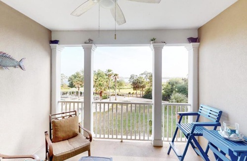 Upper Grand Lagoon House | 3rd-floor beach & pool-view condo with outdoor pool hot tub grills balcony