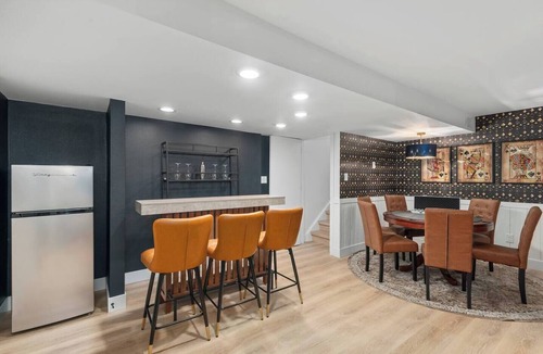 Oak Park House | Arvada Family Retreat with all the amenities: pool, sauna, arcade, and much more
