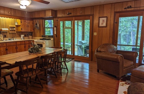 Harrisonville Cabin | Backyard creek, screened porch
