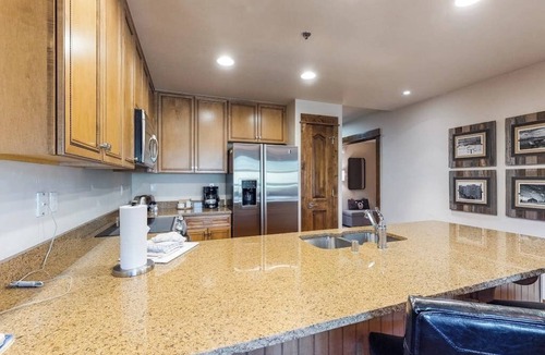 Four O'Clock Condo | Beautiful ski-in/ski-out villa with shared game room, hot tub, pool, & gym