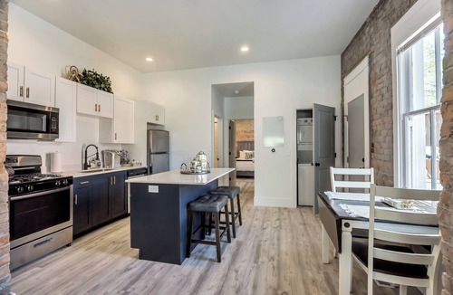 Downtown Salt Lake City Apartment | Chic Brick Loft with Fireplace & King Bed U2