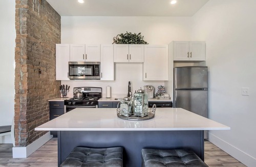 Downtown Salt Lake City Apartment | Chic Brick Loft with Fireplace & King Bed U2
