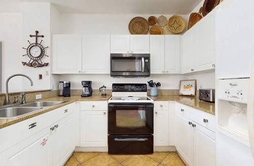 Frangista Beach Condo | Comfortable ground floor condo with pool & hot tub access, W&D, WiFi, and AC