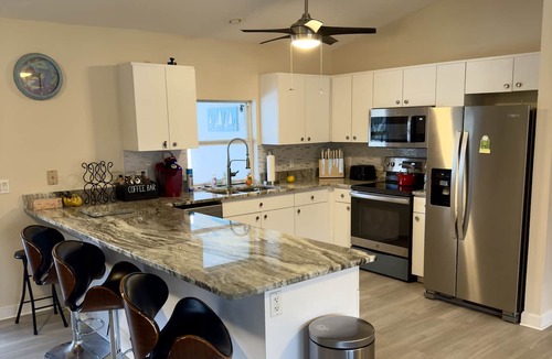 Port Charlotte House | Double Lot Canal Front Ranch- KING Bed -Heated Pool Near Warm Mineral Springs