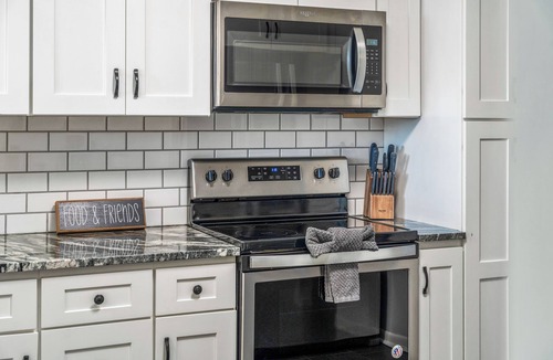 Arvada Plaza Area House | Hot Tub + Games | Epic 6BR Group Home in Arvada