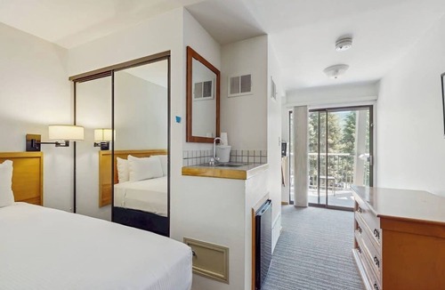 West End Cabin | Main St. studio - pool & hot tub - walk to lifts, dog-friendly, balcony