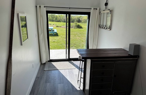 Brookline Station Cabin | Modern Glamping Cabin in Springfield with king bed and AC on 3 private acres.