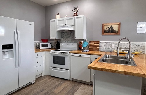 Southport Cottage | New Lake Front Studio Style Cottage - w/private dock, kayaks and full kitchen