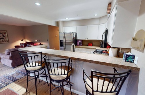 Mountain House Condo | On River Trail, 2 Hot Tubs! Ground Floor. Walk to Festivals, Dining, Shops