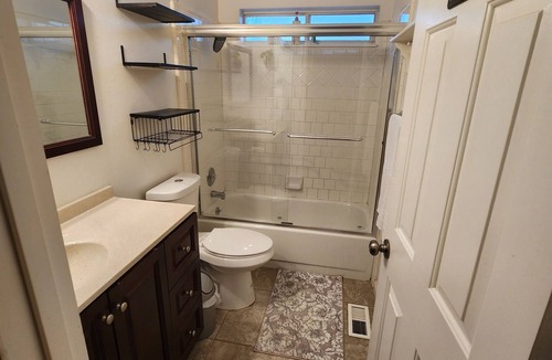 West Jordan House | Private bedroom with a shared bathroom in west jordan