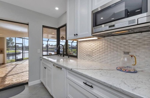 Punta Gorda House | SENSATIONAL! WATER-VIEW, LUXURY REMODEL, SUNNY HEATED POOL, HUGE 145’ SEA WALL