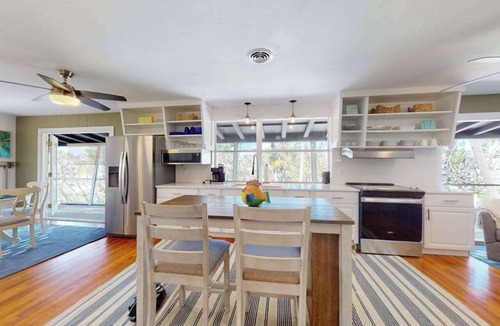Palm Island House | Tropical Palm Island home steps from the beach with grill, outdoor shower, dock