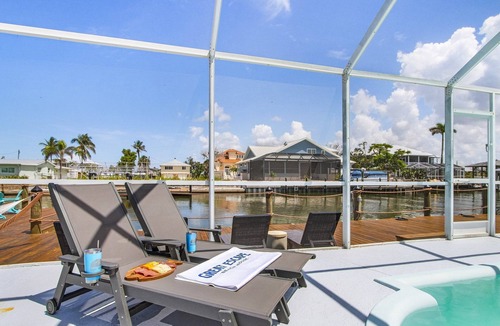 South Island House | Waterfront Beach-Style Retreat with Pool, Dock & Game Room in Fort Myers