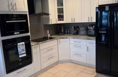 Palm Harbor House | Waterfront Lake Tarpon Home with heated salt water pool, fitness room, WiFi