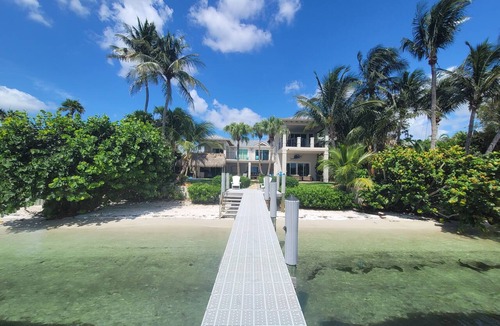 Boynton Beach Villa | Waterfront oasis w/white sand beach, pool & dock minutes to Delray & Palm Beach!