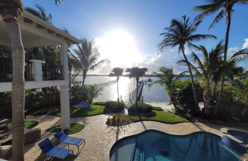 Boynton Beach Villa | Waterfront oasis w/white sand beach, pool & dock minutes to Delray & Palm Beach!