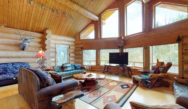 Beautiful Riverfront Log Cabin with Mountain Views, Firepit, and Gas Grill