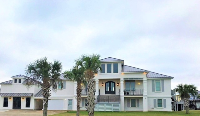 BEAUTIFUL WATERFRONT HOME WITH BOATHOUSE AND HUGE PORCHES! in Hackberry