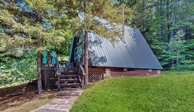 Charming gingerbread A-frame situated on 3 acres, woodstove, A/C, deck in Windham