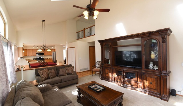 Enjoy the large patio and shaded back yard of this large home with 2 kitchens