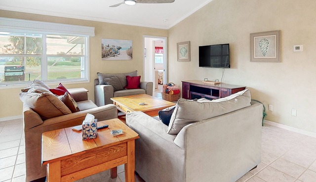 Golf course-view retreat with a private, heated pool, lanai, AC, & washer/dryer