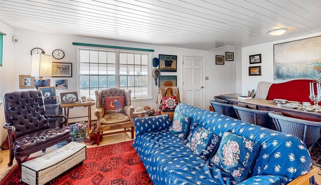 Idyllic rural home with private pond, river access, pool, patio, & covered decks