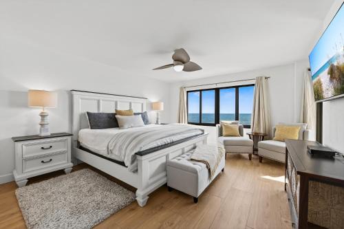 Luxury direct oceanfront corner with a large private balcony, heated pool and garage in Ormond Beach