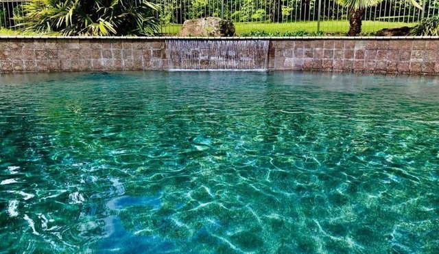 POOL with waterfall.Fenced yard! Fire pit, Hot tub, big deck and big fish! in Heber Springs
