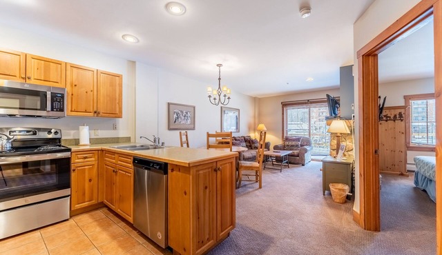 River Run Condo with Spacial Balcony overlooking Ice Rink & Mountain Views!