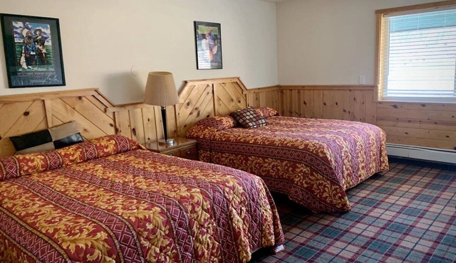 Room With Scenic Lake And Mountain Side Views