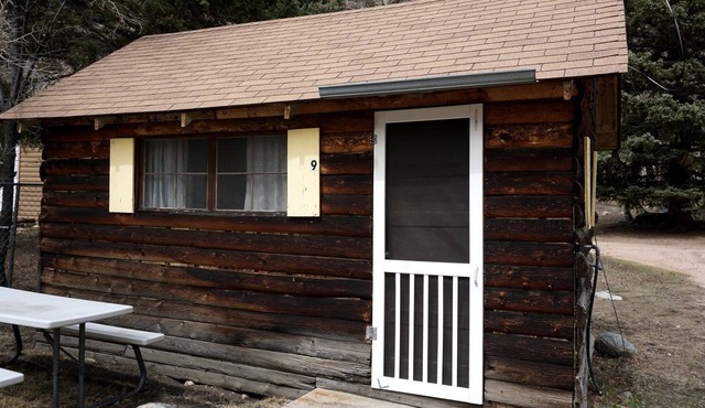 Simple Country Cabin with Ornate Wood Stove in the Colorado Mountains of Poudre Canyon in Bellvue