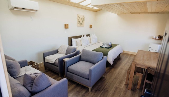 Solar Powered Casita with 2 beds and a comfy seating area overlooking a peaceful desert setting