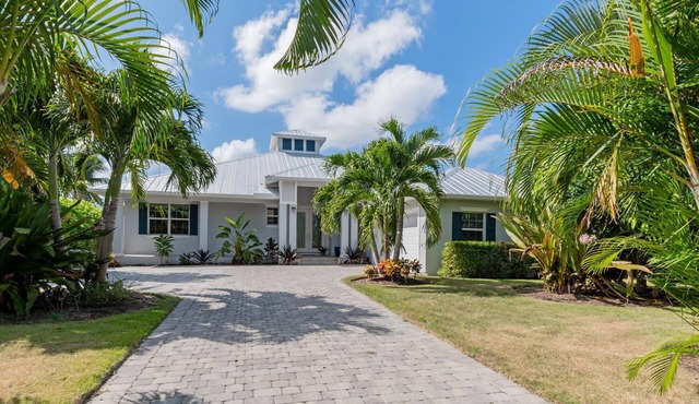 Spectacular Waterfront Pool Home With Expansive Sundeck & Boat Dock Area in Naples