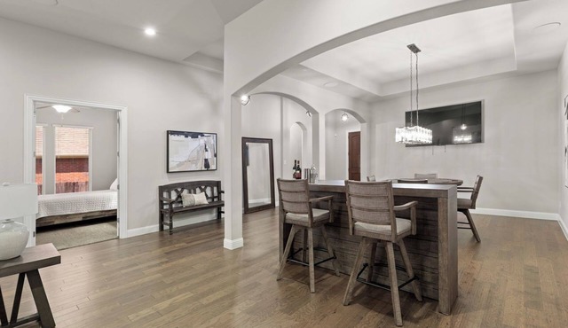 This beautiful 3200 SF single storey with loft backs onto a heavily treed forest in Dallas