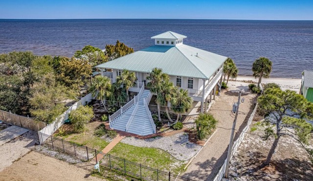 This Cape Cod style beauty will make you fall in love with the Forgotten Coast! in Alligator Point