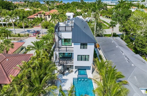 Saint Armands Key House | Showstopping home with a Pool, Rooftop Deck, and Games! Sun-Day Style