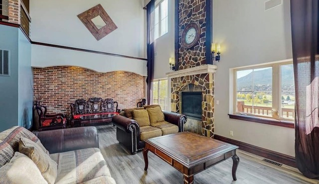 Luxe home on Gypsum Creek Golf Course with fireplace and mountain views